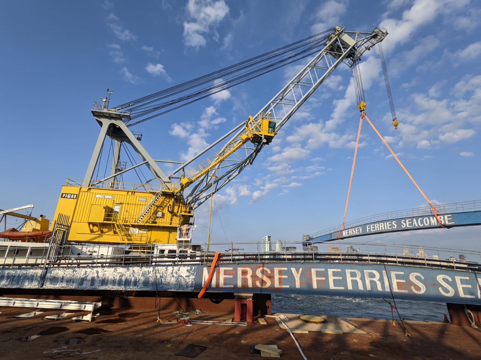 Merry Ferry linkspans being removed by yellow crane.