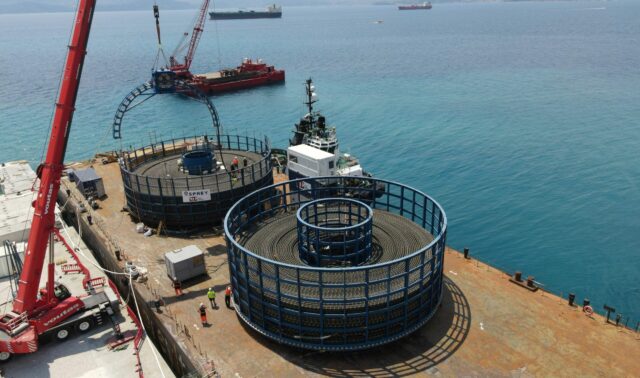 Osprey barge - the Intrepid - in Greece, loading array cables for Seagreen windfarm into two 2,000 te cable carousels. 